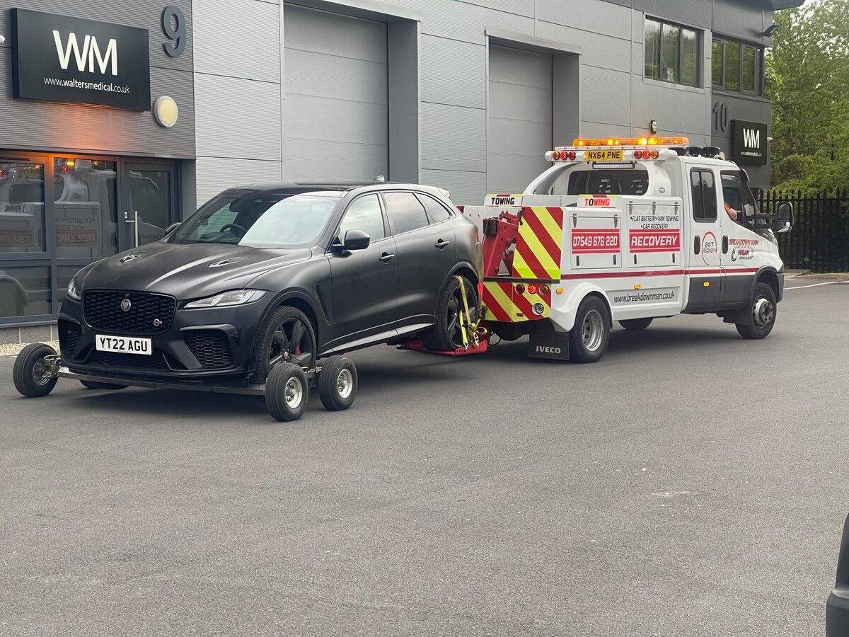 Recovering a Jaguar F-Pace SVR on dollies — premium-vehicle tow by Breakdown Man.