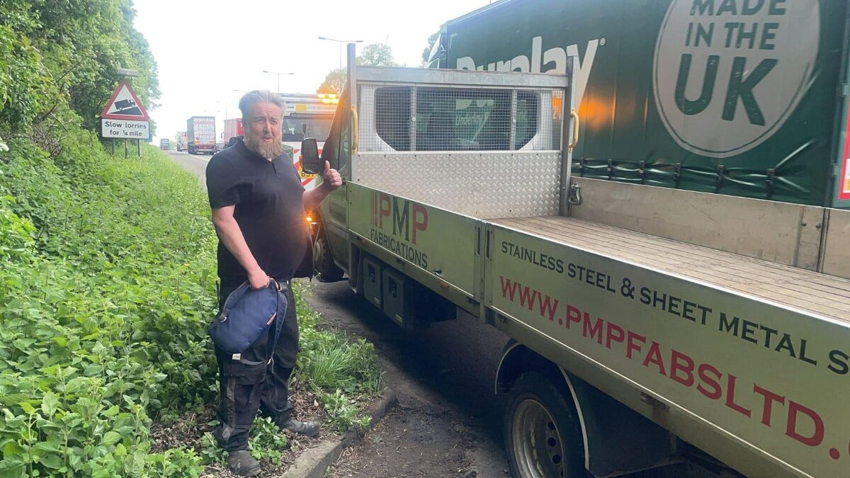 Simon at the roadside with a PMP Fabrications stainless steel recovery truck on a slow-lorry lay-by.